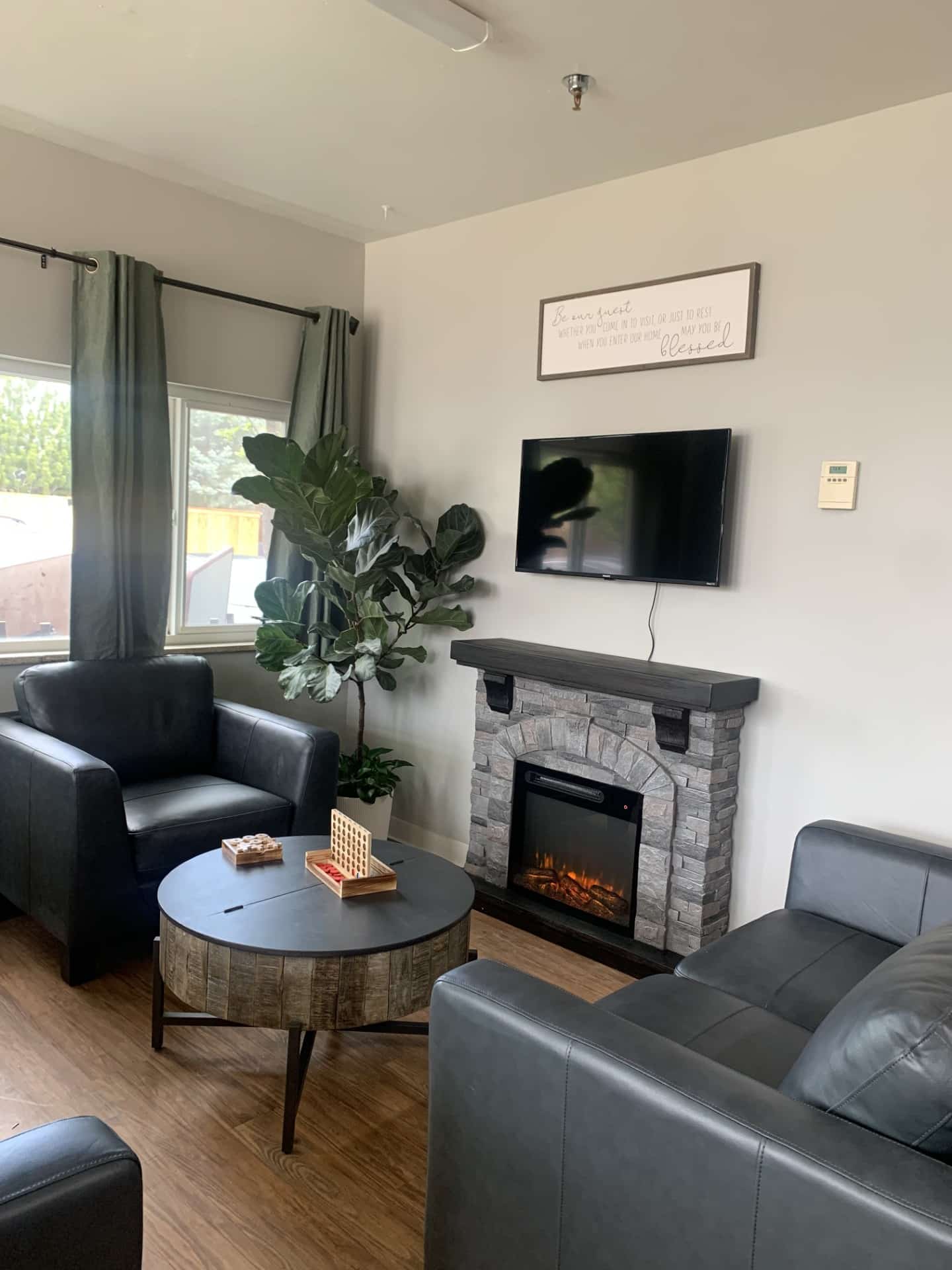 Fireplace and chairs in lobby of Boulder PA